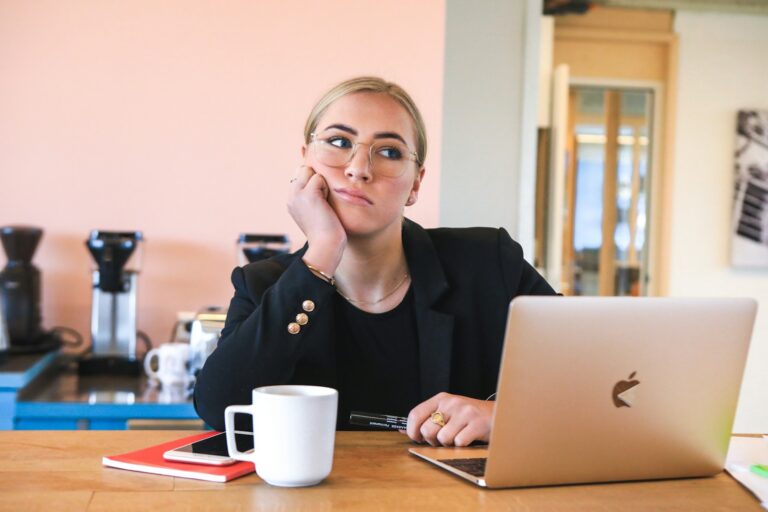 Breakthrough Abundance Growth woman in black long sleeve shirt using macbook