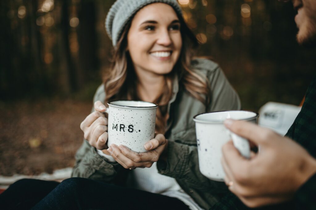 woman holding white mug how attitude affects performance